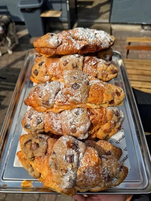 Chocolate-chip pastries dusted with icing sugar at Brewch.