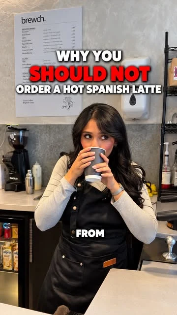 A Brewch barista with a hot Spanish latte.